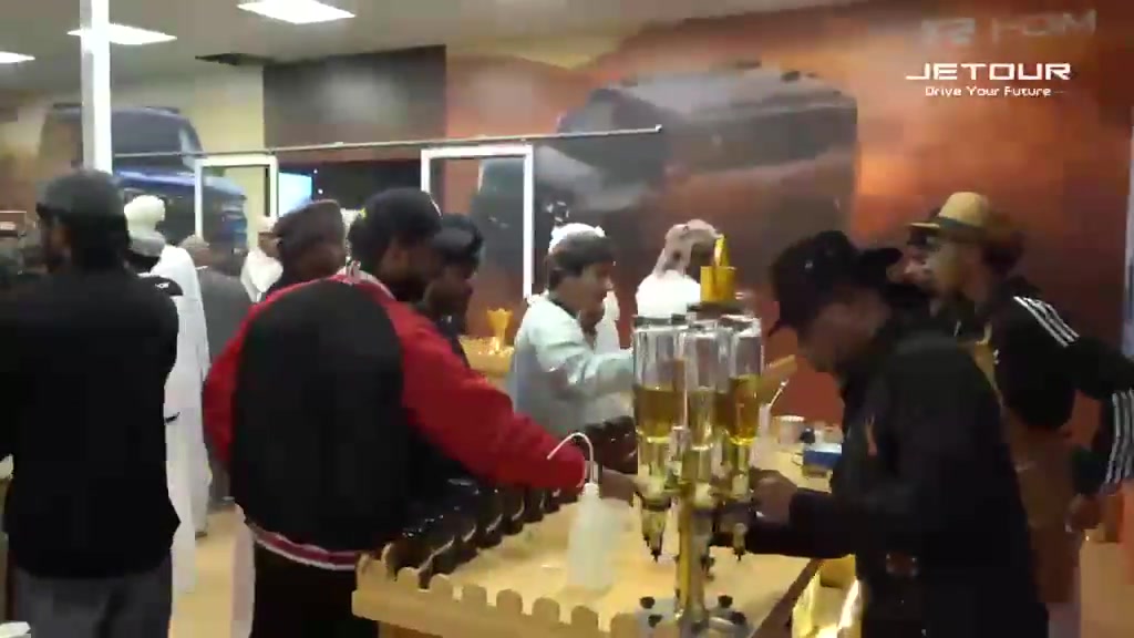 Guests being served refreshments during the Jetour event