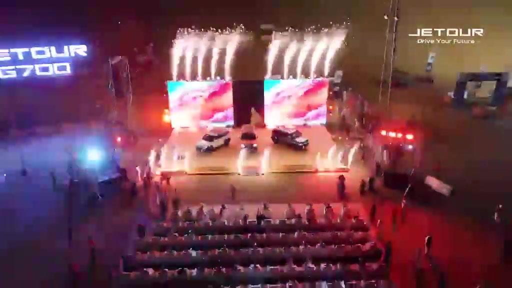 Aerial view of the Jetour G700 stage and vehicle reveal with fireworks.